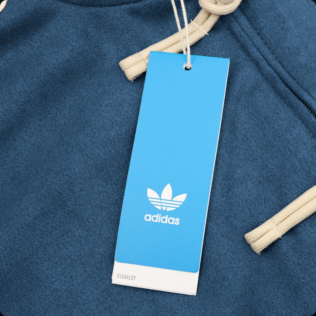 Chamarra adidas Tang Año Nuevo Chino azul marino, detalle de la etiqueta