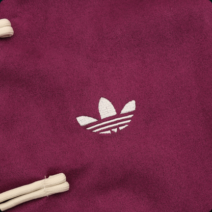 Chamarra adidas Tang Año Nuevo Chino vino, detalle del logo